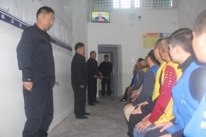 DETAINEES GUARDED BY POLICE IN INTERNMENT CAMPS OF XINJIANG. PHOTO: THE VICTIMS OF COMMUNISM MEMORIAL FOUNDATION VIA AFP​​