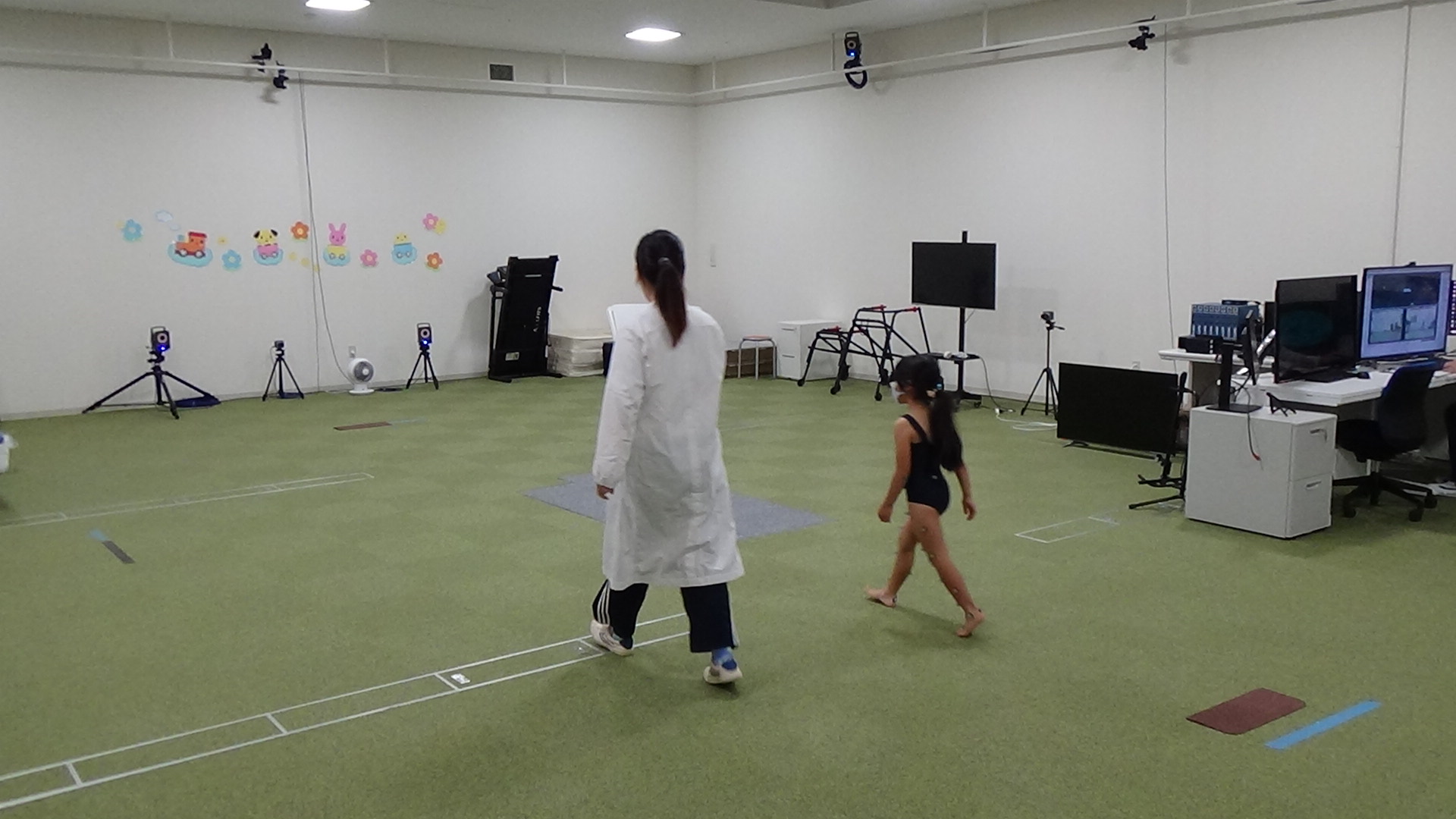 Scientists used a 3D gait analysis system, which required sticking small spherical markers onto children’s lower bodies, to track how the kids walked. Photo: Courtesy of Tadashi Ito