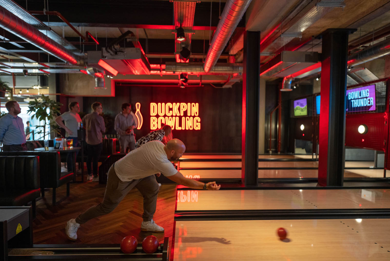 Writer Tom Usher playing bowling at the giant Brewdog