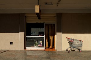 A store with an empty trolley outside