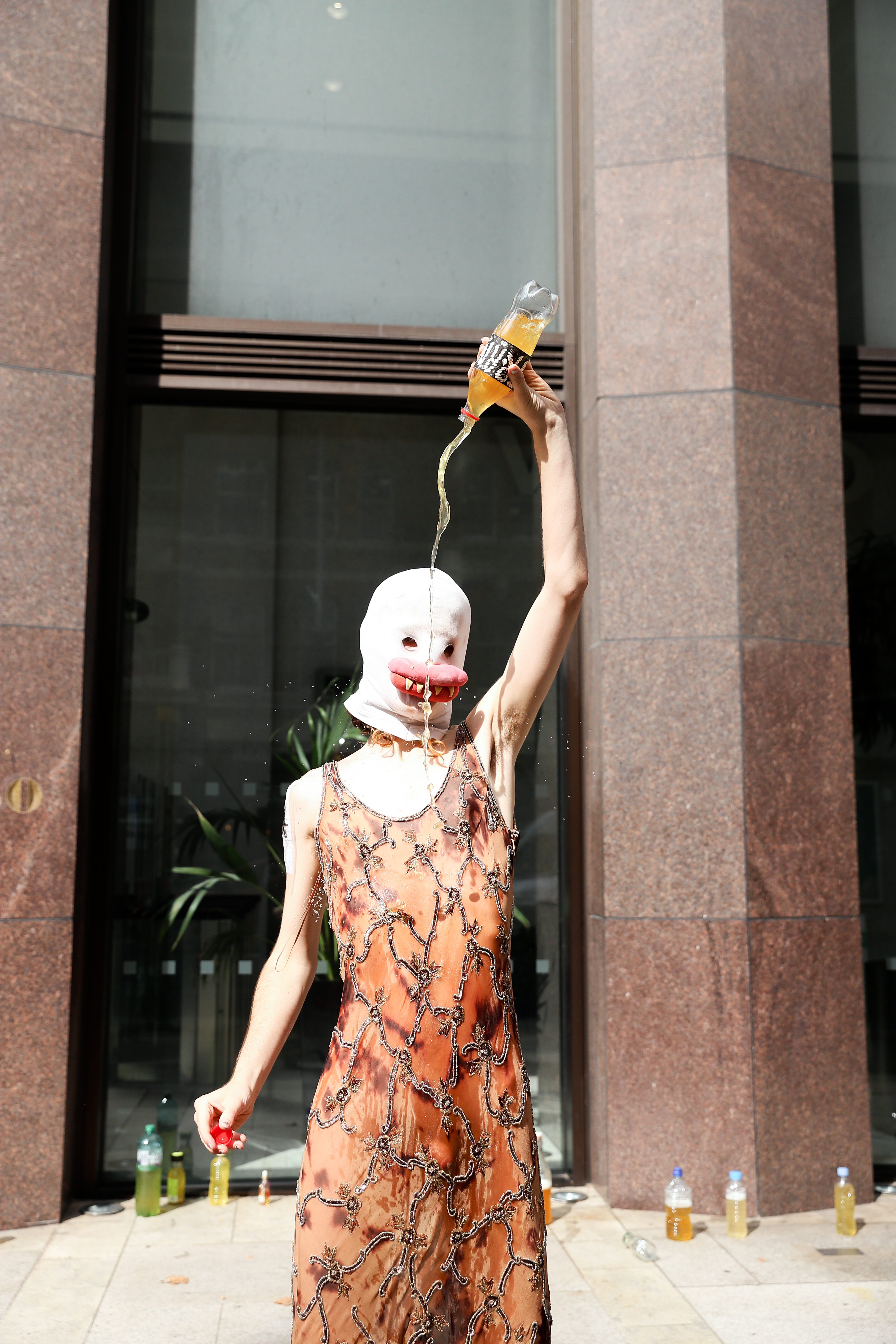 A POT activist pours urine over herself to protest the EHRC.