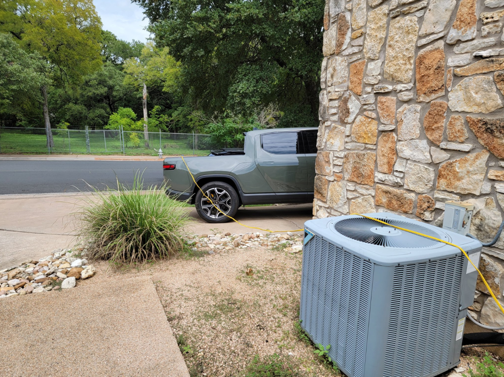 Rivian with electric cord