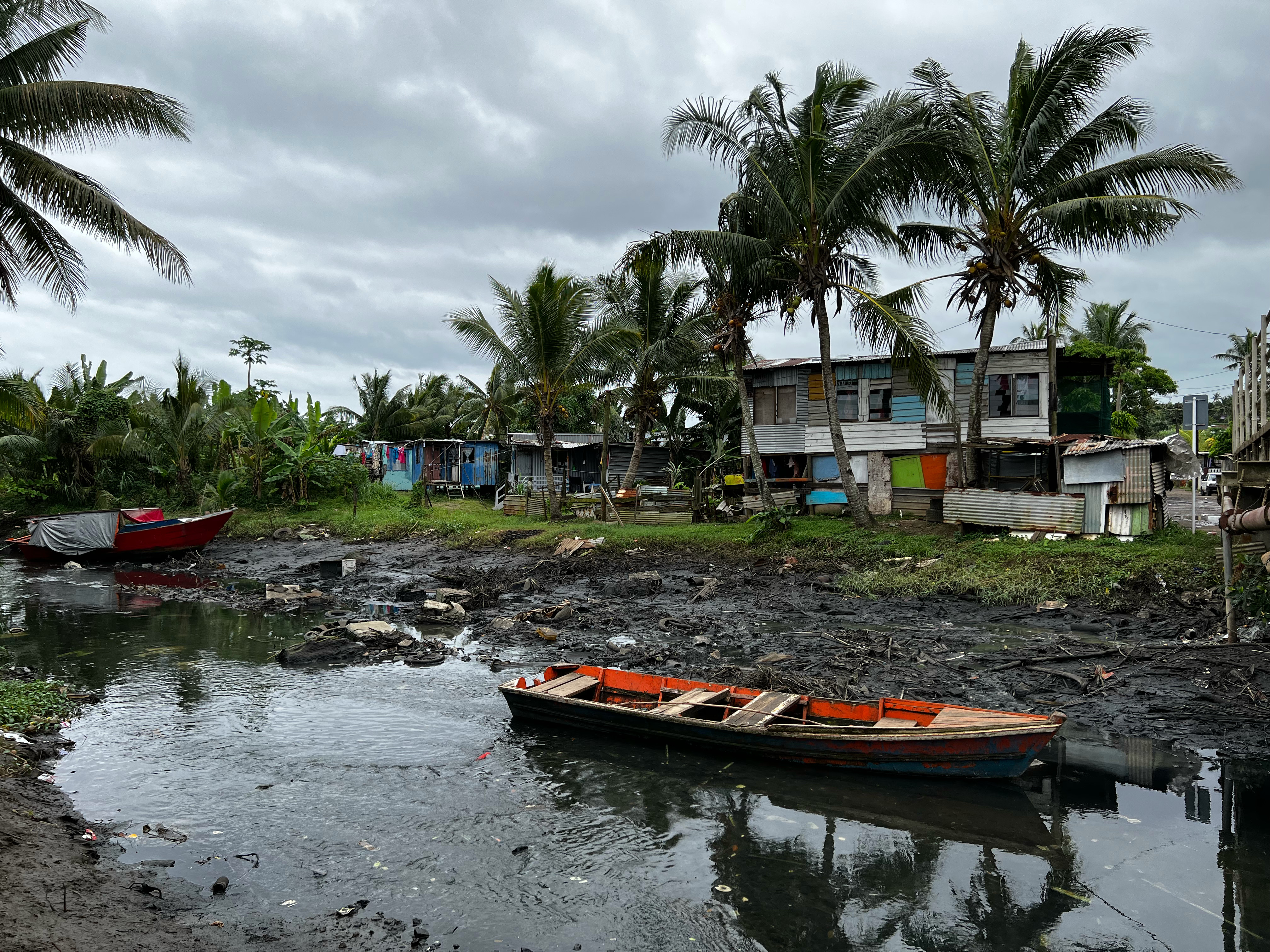 A heavily polluted river runs through the heart of one of Suva’s informal settlements. Photo: Gavin Butler