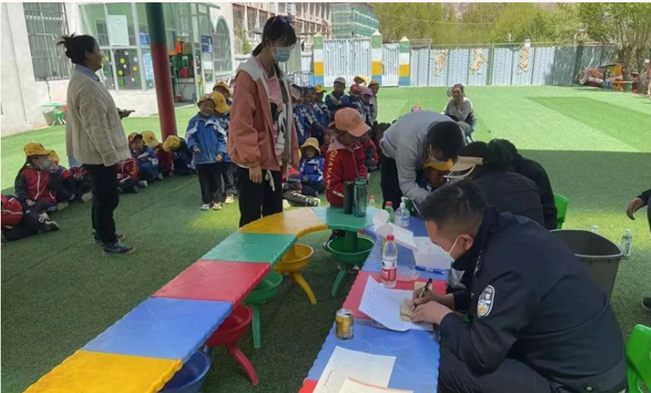 POLICE OFFICERS COLLECTING DNA FROM CHILDREN IN TIBET. PHOTO: NYEMO COUNTY PUBLIC SECURITY BUREAU