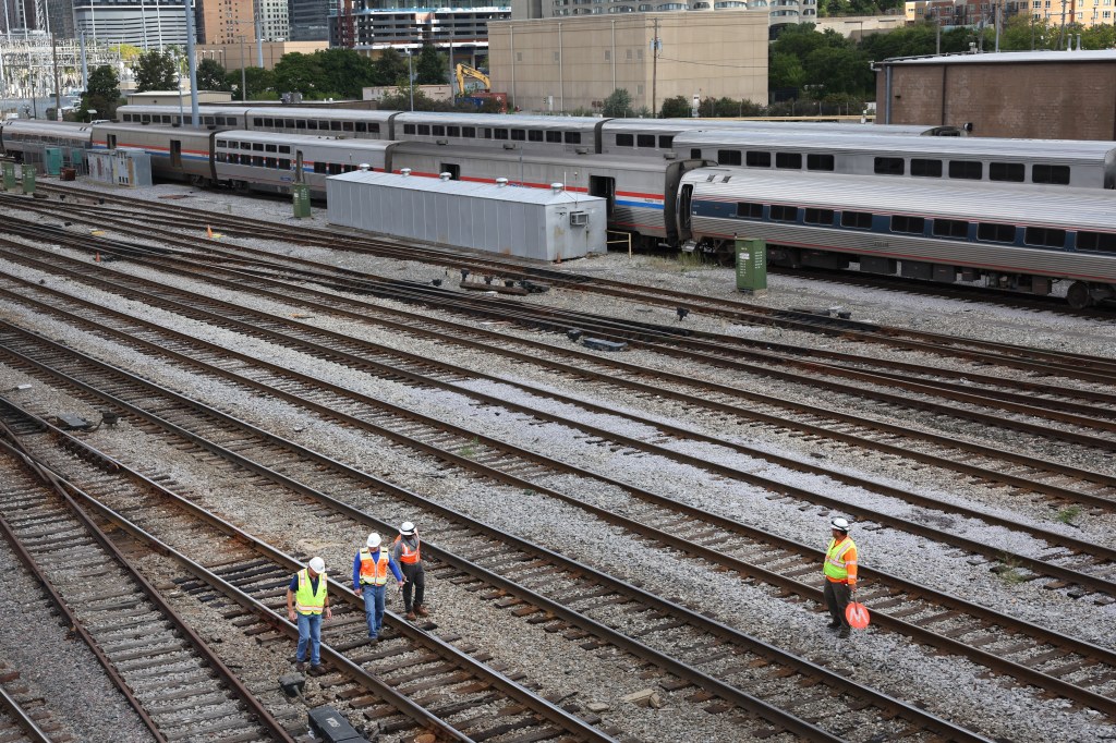 Freight rail workers on tracks