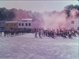 Soldiers face off against other soldiers in costume in a tactical scenario village called Riotsville