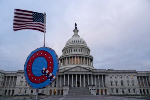 Someone holds a "Q" sign outside the U.S. Capitol in Washington, D.C., U.S., on the day of the Capitol Riot on Jan. 6, 2021.