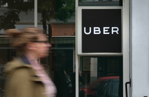 A woman walks past an Uber drivers registration office on May 10, 2019 in Berlin, Germany.