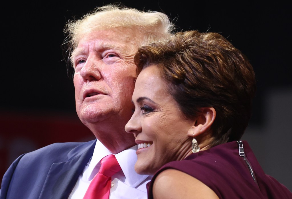 Former President Donald Trump embraces Republican candidate for governor Kari Lake at a ‘Save America’ rally in support of Arizona GOP candidates on July 22, 2022 in Prescott Valley, Arizona.