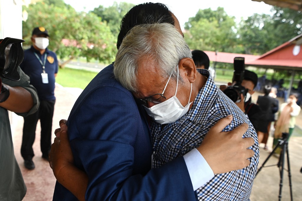 Cambodian survivor of Khmer Rouge war crimes is comforted after the judgement of the Extraordinary Chamber in the Courts of Cambodia (ECCC).