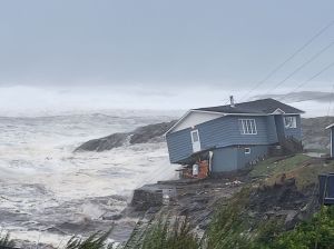 A home battles storm Fiona in Port aux Basques, Newfoundland and Labrador, Sept. 24, 2022. The home was eventually lost to the sea.