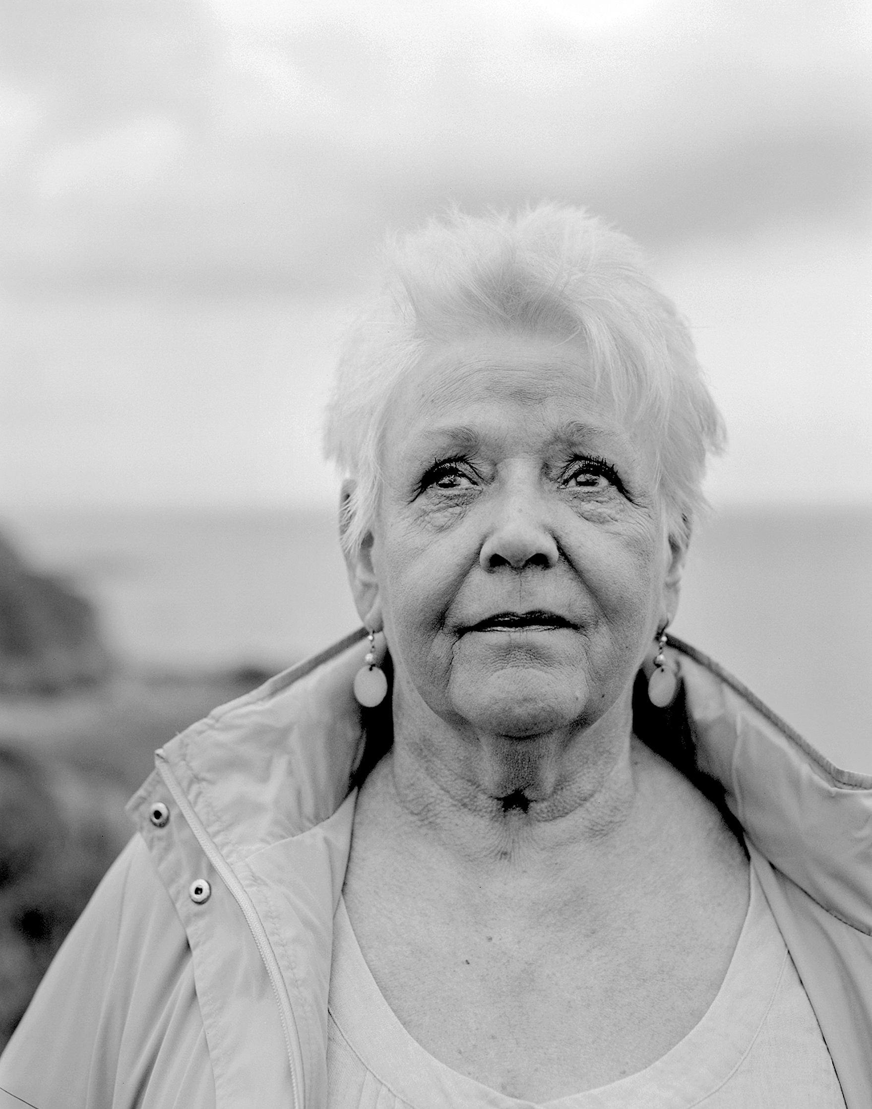 A woman with white hair in the northeast of England by Joanne Coates