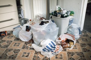 A pile of trash in someone's kitchen, photo by Chris Bethell