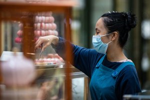 young worker at a cake store