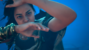 Screenshot from Forspoken, the main character raises her arms defensively infront of her face