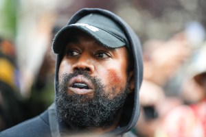 Kanye West aka Ye is seen wearing a Balenciaga boxing mouthguard, outside Givenchy, during Paris Fashion Week - Womenswear Spring/Summer 2023 - Day Seven on October 02, 2022 in Paris, France.