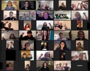 Unionised Apple workers in Australia raise fists on a Zoom call ahead of planned strike action.