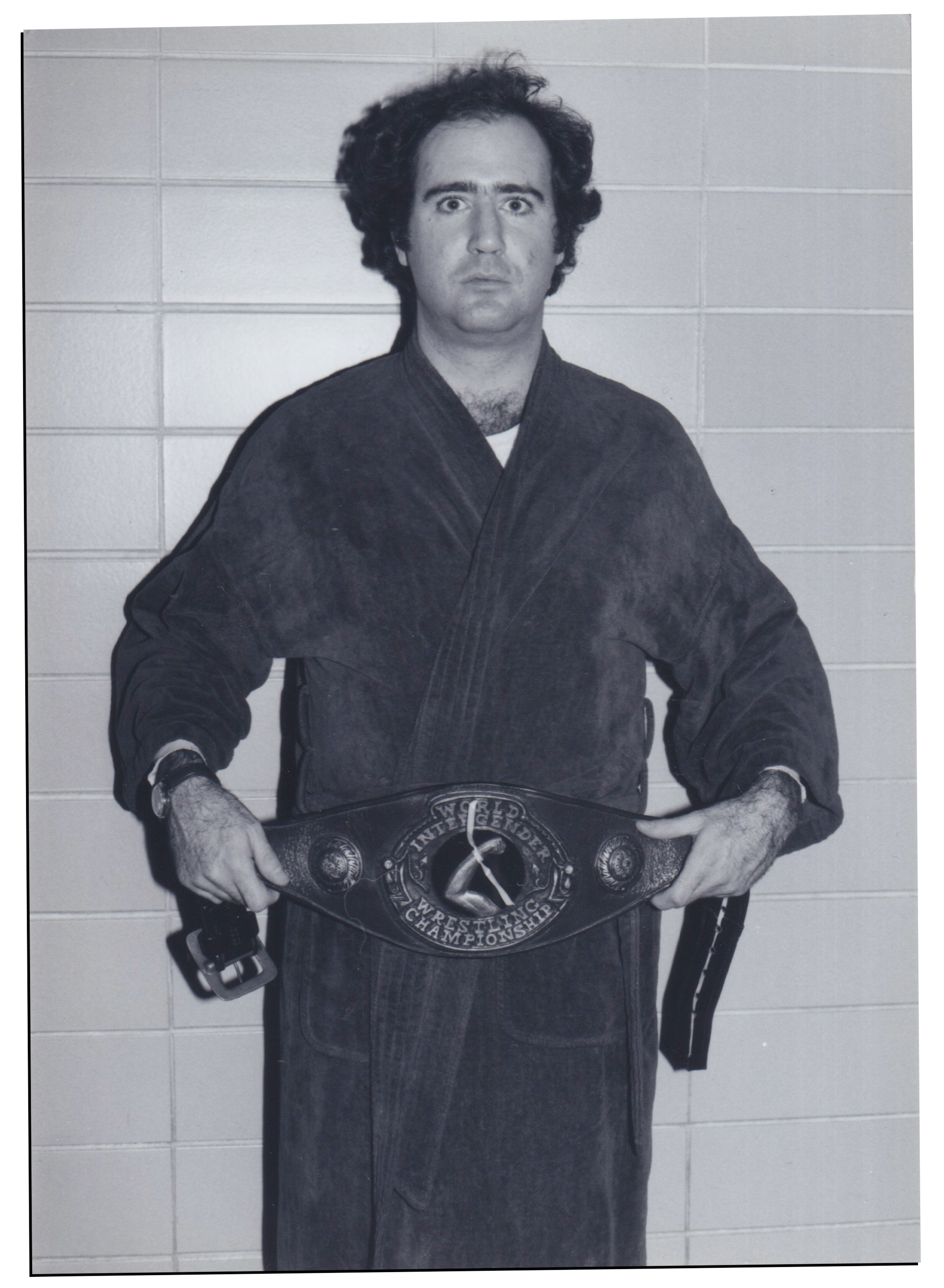 Kaufman portrait with wrestling championship belt in black and white film