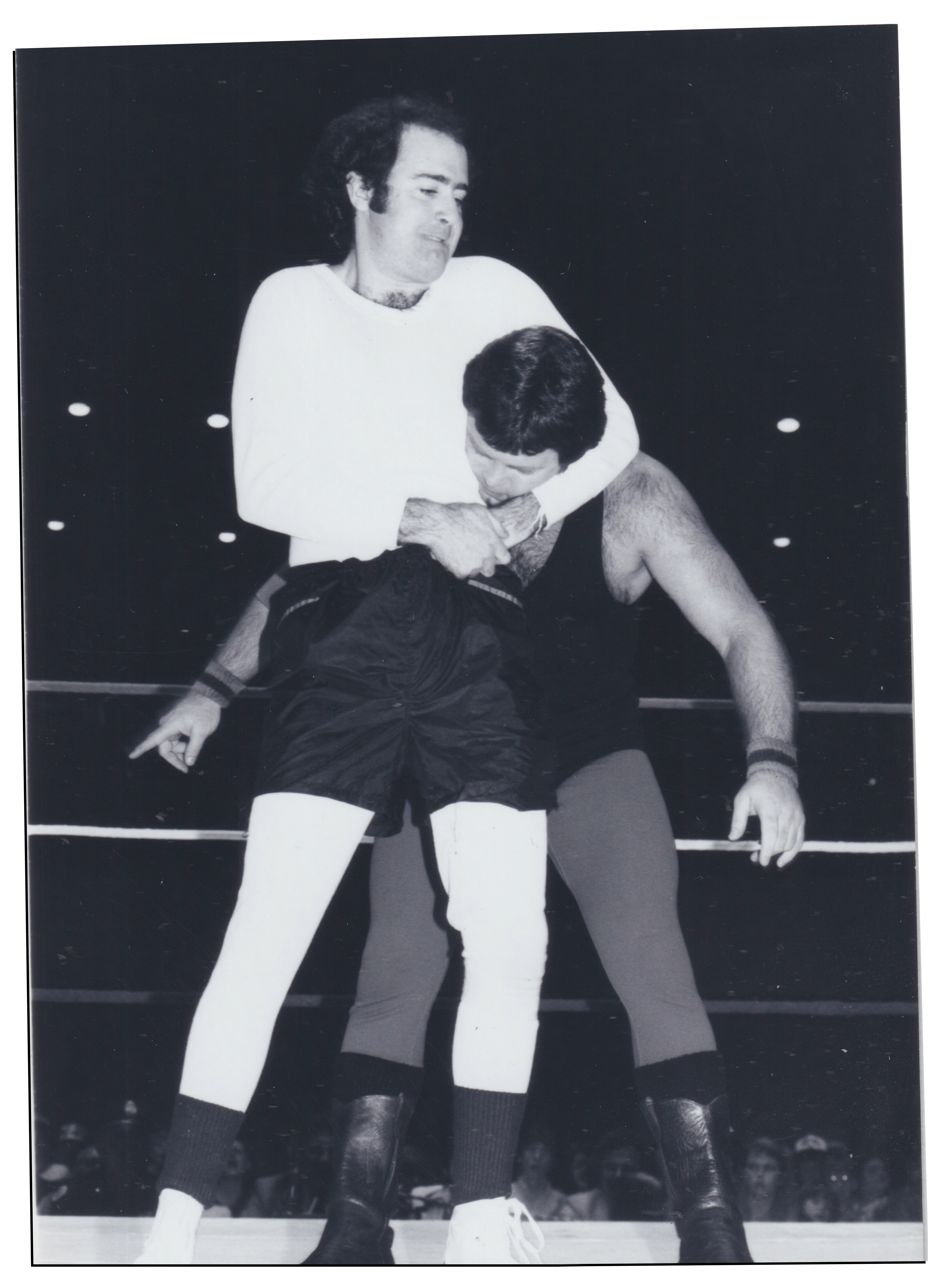 Kaufman putting Lawler in headlock in black and white film photography