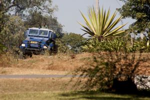 Malawian policeman rides in an armoured vehicle​.