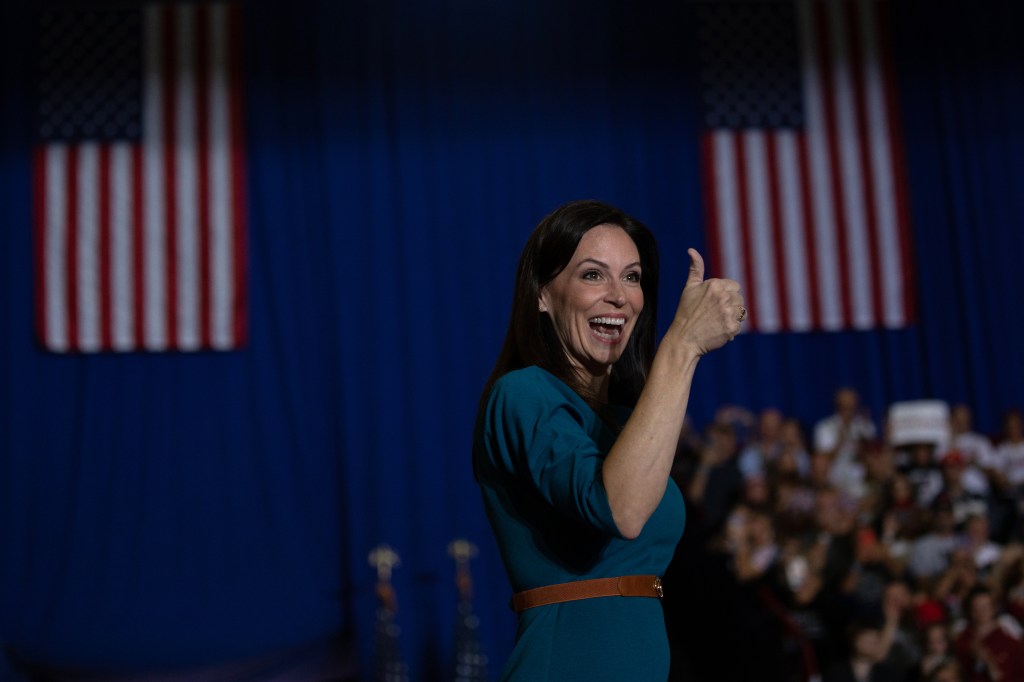 Republican gubernatorial candidate Tudor Dixon gives a thumbs up during a Save America rally on October 1, 2022 in Warren, Michigan.​