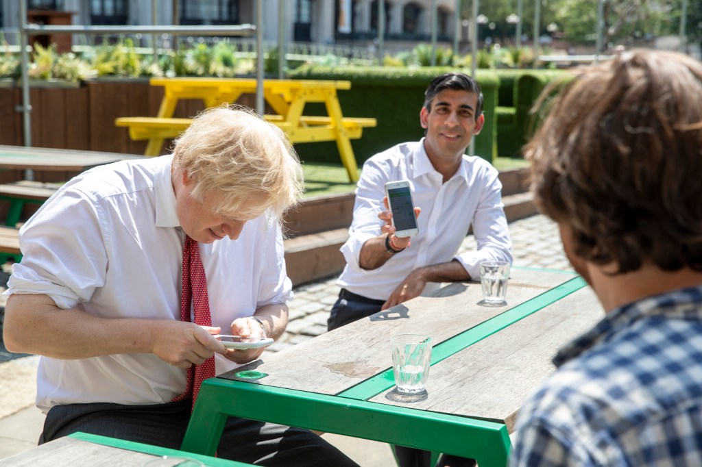 Former PM Boris Johnson and new PM Rishi Sunak on their phones