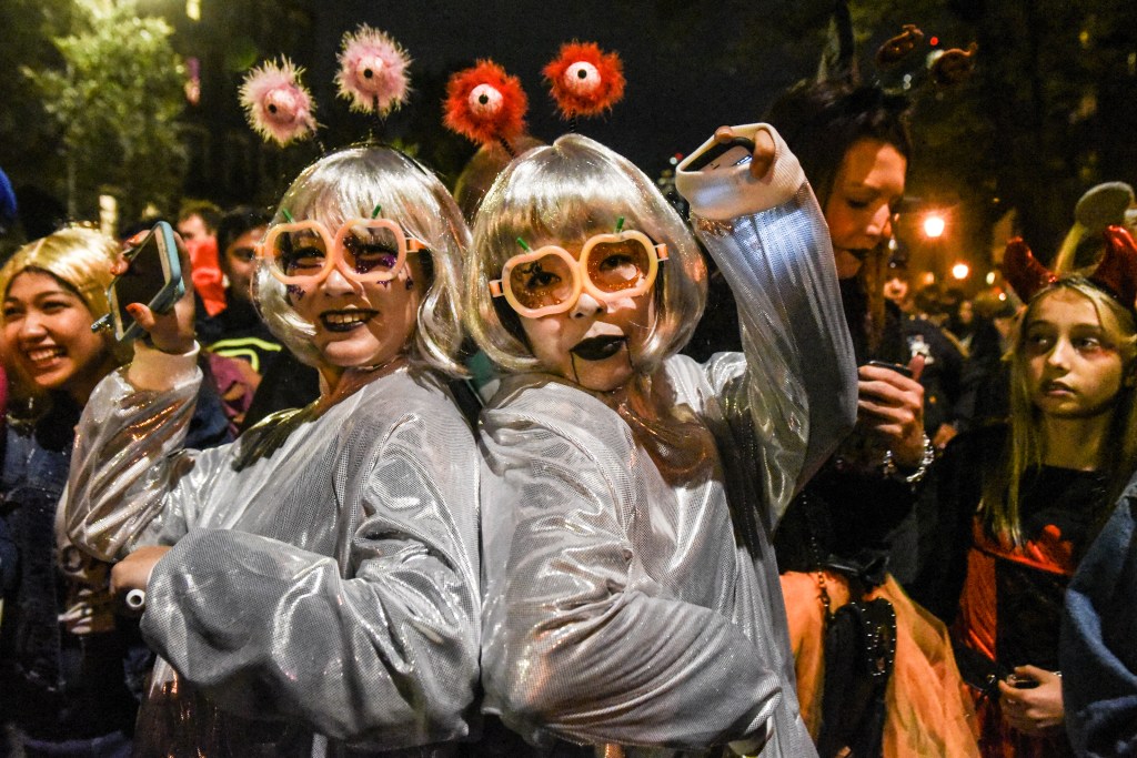 People in costume at a Halloween parade