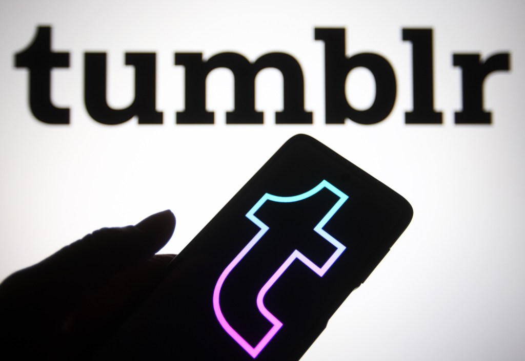 ​A hand holding a phone with the Tumblr logo on it. Getty Images