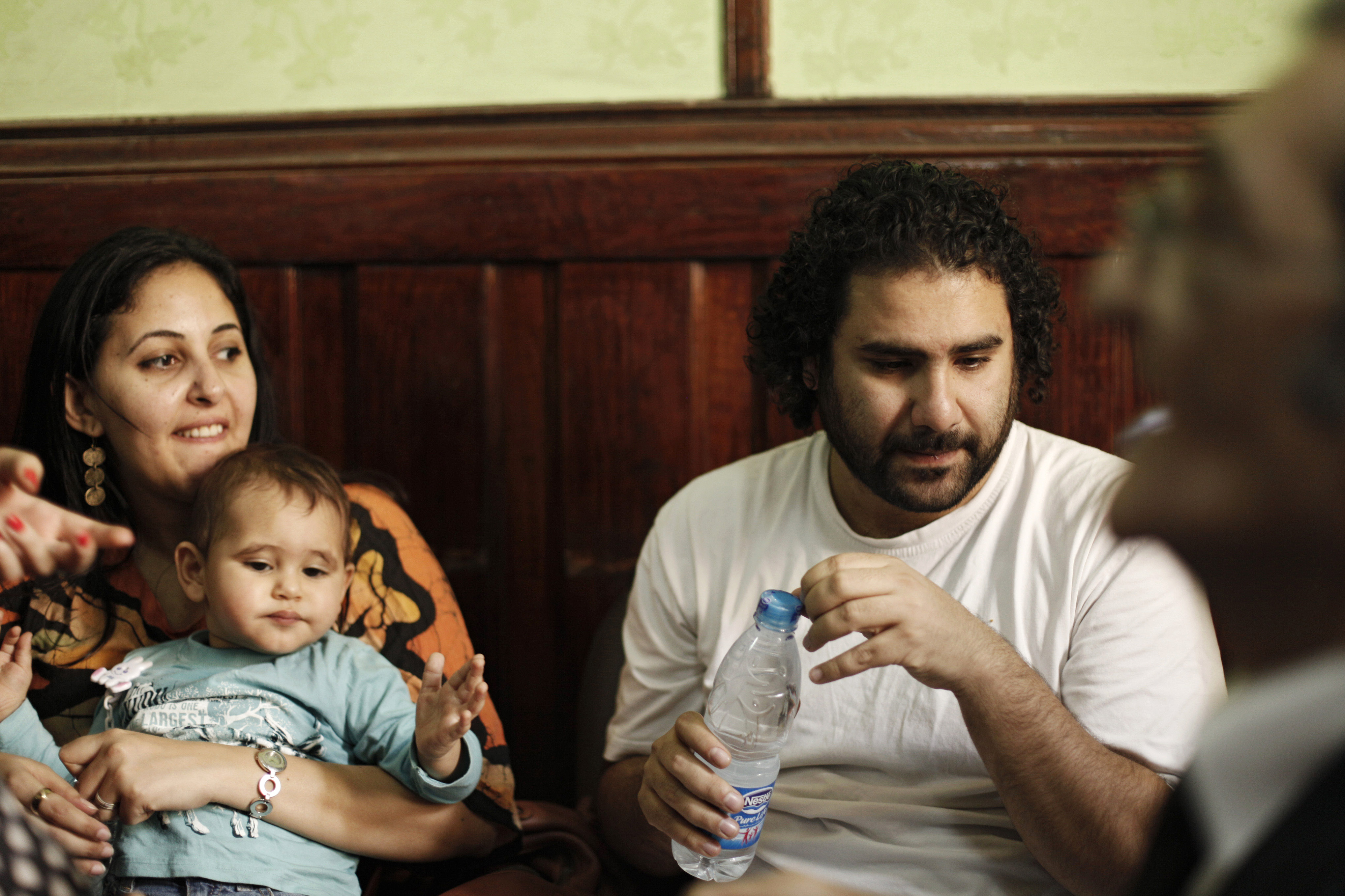 Alaa Abd el-Fattah with his wife and their son during a court hearing in 2013. Photo: Ed Giles/Getty Images