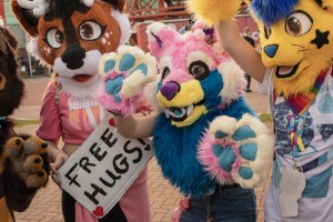 Birmingham MCM Comic Con furries holding Free Hugs sign