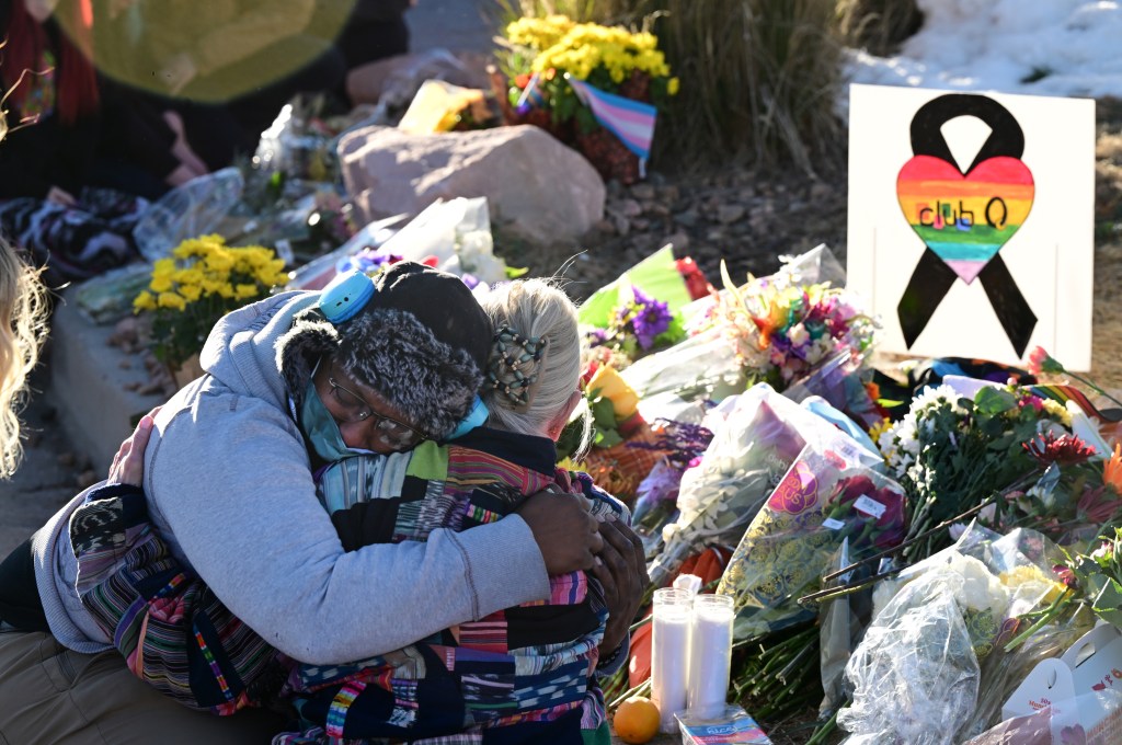 ​Mourners gather at a makeshift memorial near Club Q on November 20, 2022 in Colorado Springs, Colorado.​