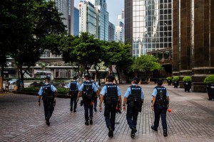 HONG KONG COPS CAUGHT SNOOPING ON WOMAN ARRESTED FOR ALLEGEDLY HAVING SEX ON BALCONY. PHOTO: ISAAC LAWRENCE/AFP​