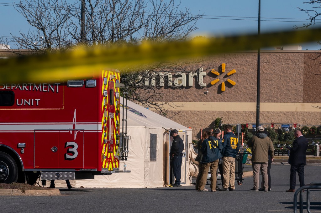 Members of the FBI and other law enforcement investigate the site of a fatal shooting in a Walmart on November 23, 2022 in Chesapeake, Virginia. Following the Tuesday night shooting, six people were killed, including the suspected gunman.