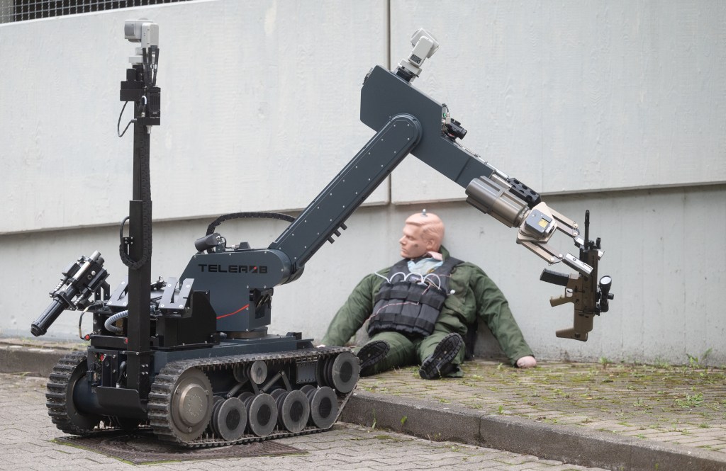 Police robot holding gun