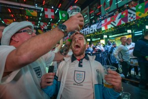 England fan screaming with joy as man raises pint