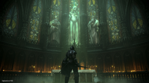 A Demon's Souls characters stands before a stained glass gallery in the back the nave of a Gothic church