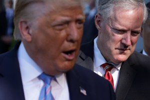 Then-President Donald Trump speaks next to White House Chief of Staff Mark Meadows on the South Lawn of the White House on July 29, 2020.