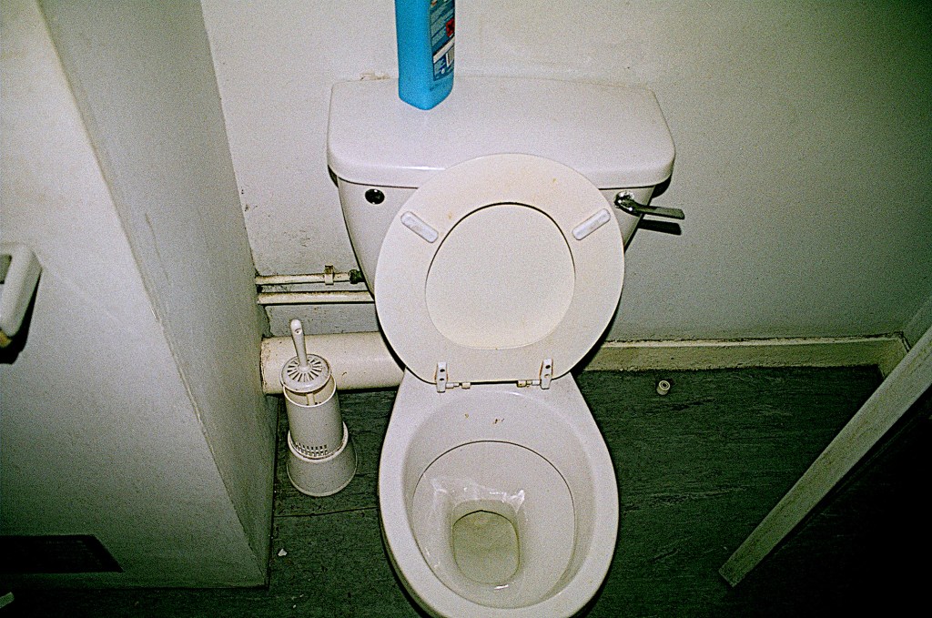 A photo of a toilet with the seat open