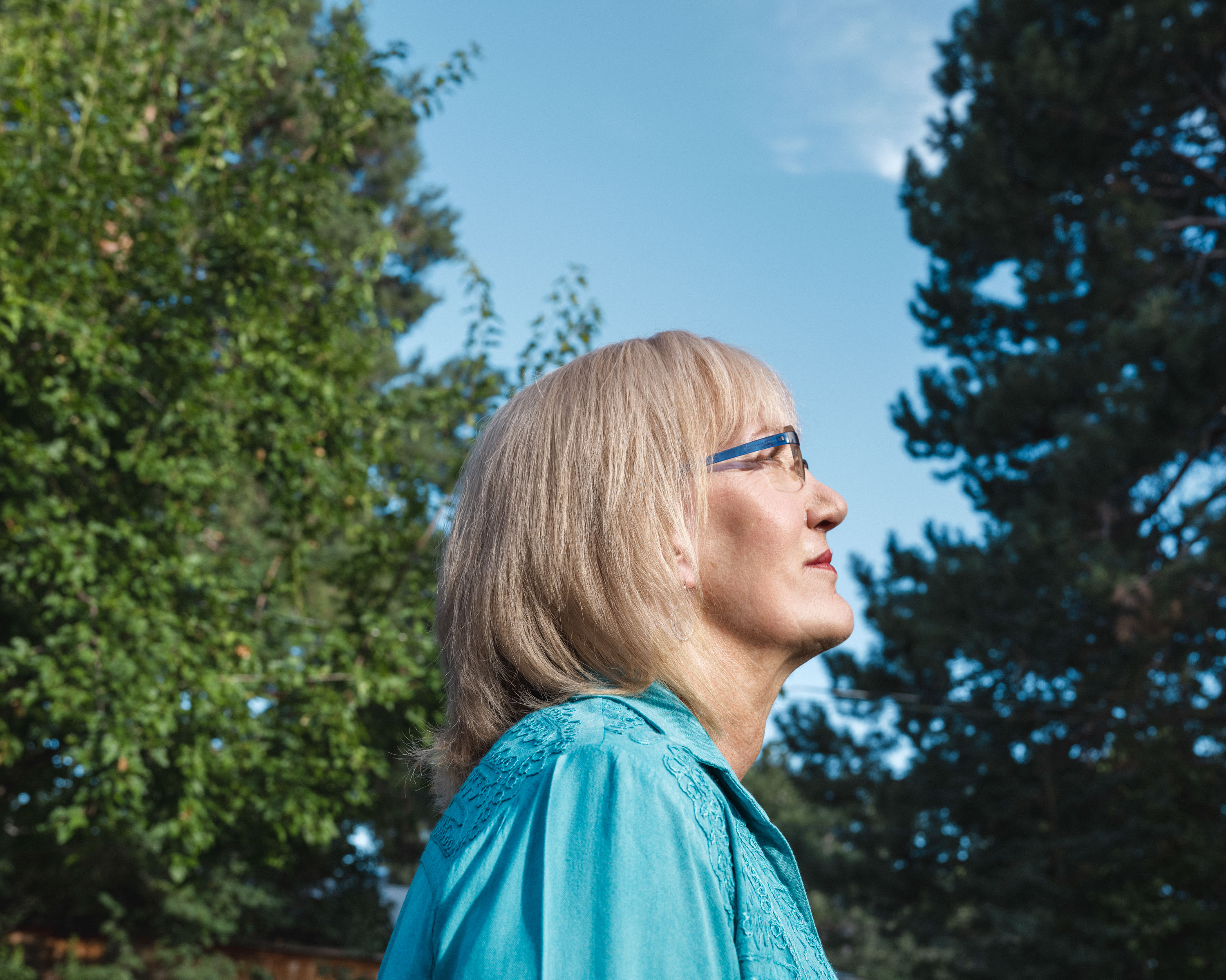 Christa Brown standing outside with trees in the backdrop