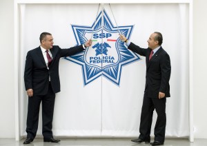 Former Mexican President Felipe Calderon (R) and then Secretary of the Mexican Federal Police Genaro Garcia Luna (L) prepare to inaugurate the Mexican Federal Police new Intelligence Center, in Mexico City, on November 24, 2009.