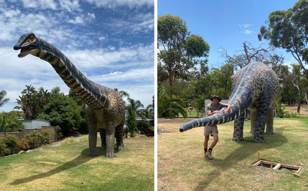 a man stands next to a giant dinosaur