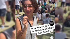 A woman holds a microphone at The Australian Open