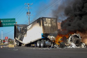 A truck burns on a street in Culiacan, Sinaloa state, Thursday, Jan. 5, 2023.