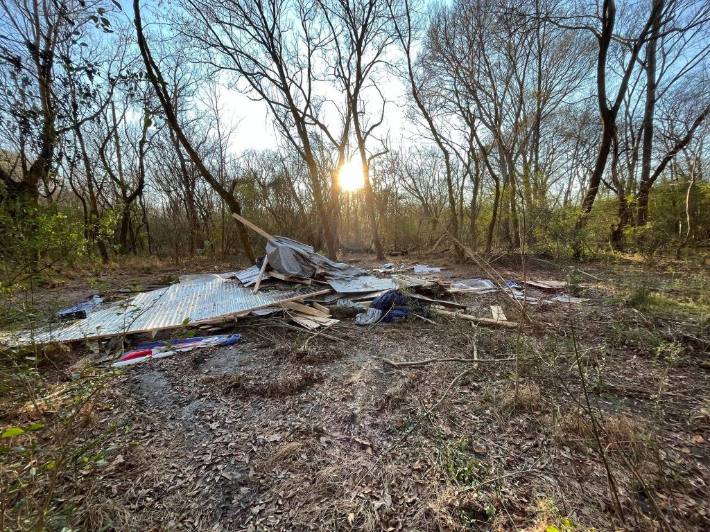 A makeshift shack destroyed by police after a raid on Dec. 13, 2022