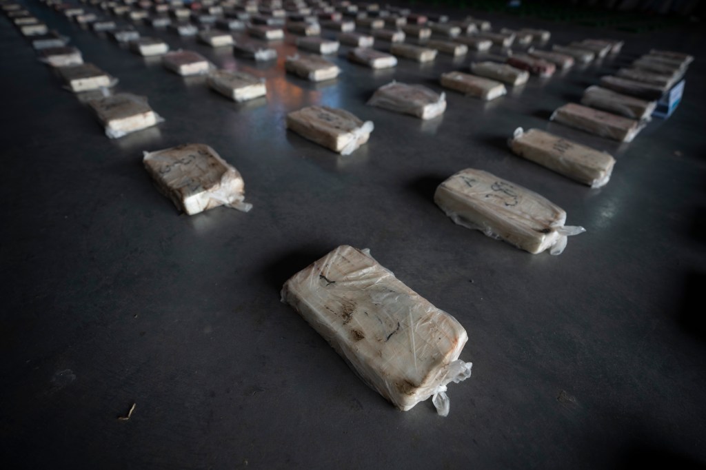 Confiscated cocaine is shown to the press at a police hangar in Buenos Aires, Argentina, Thursday, Oct. 6, 2022.