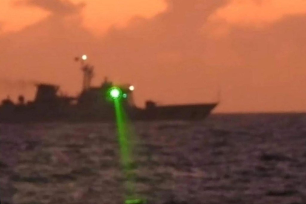 The Philippine Coast Guard on February 13 accused a Chinese vessel of shining a "military-grade laser light" at one of its boats in the disputed South China Sea, temporarily blinding members of the crew.