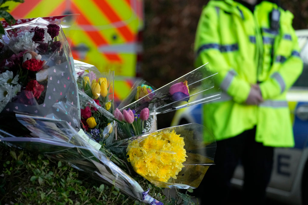 Floral tributes are left as police attend the scene where 16-year-old Brianna Ghey was found with multiple stab wounds on a path at Linear Park in Culcheth. Photo: Christopher Furlong/Getty Images