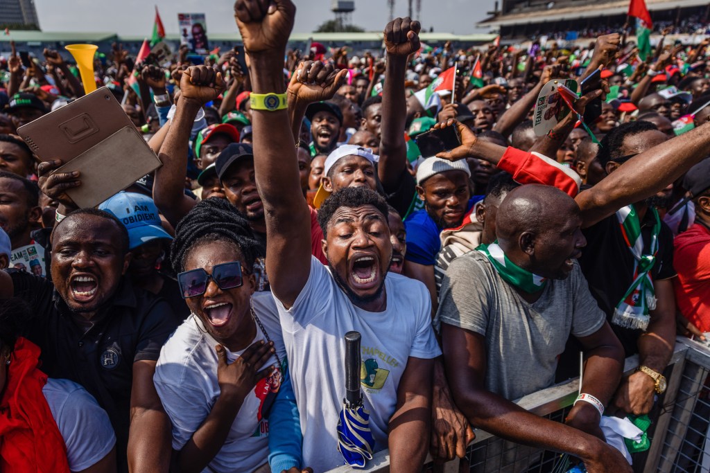 Supporters raise their hands and chant slogans during a campaign rally for Peter Obi, presidential candidate for the Labour Party, in Lagos, Nigeria