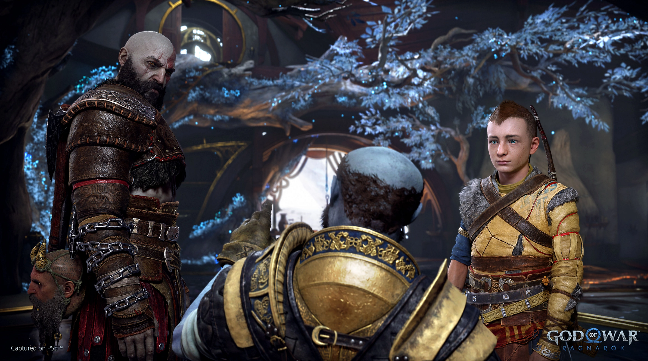 Brok looks upon his two friends, Kratos and Atreus.