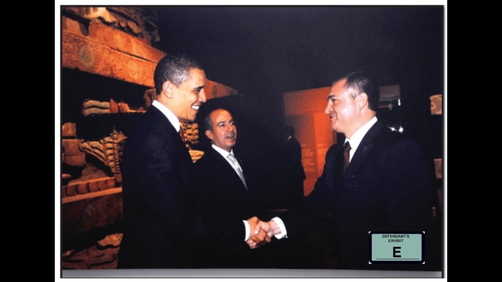 ​President Barack Obama shakes hands with then-Mexican top cop Genaro García Luna in a court exhibit photo.